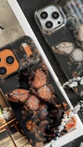 قاب موبایل آیفون پروانه ترنسپرنت مشکی پولکی طلایی - تصویر 2