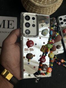 قاب موبایل ( آیفون - سامسونگ ) ام اند ام M&M آیینه ای بنددار - تصویر 3